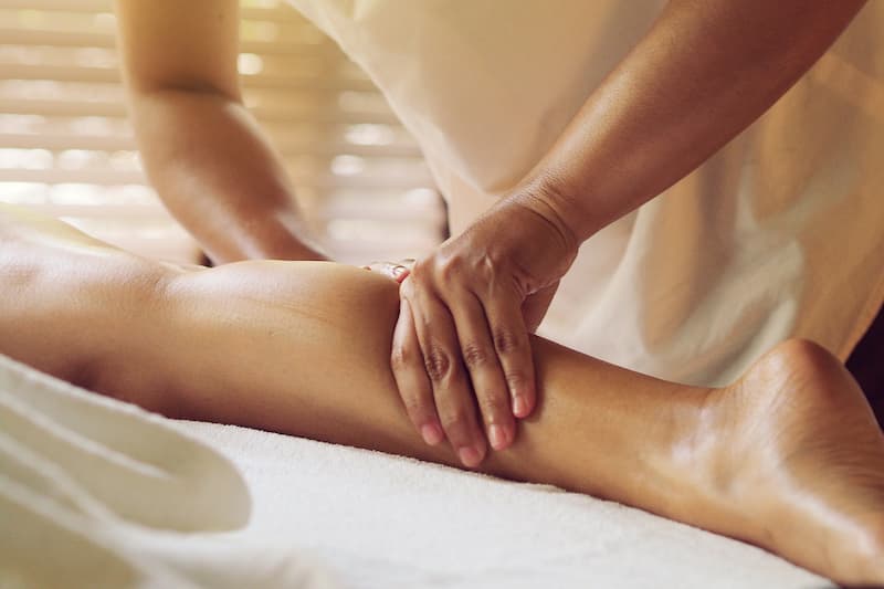 how to massage thighs and legs